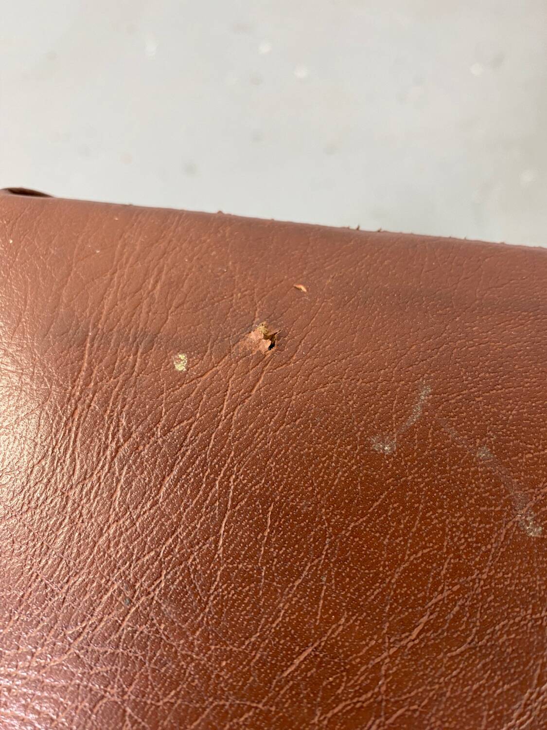 Small stool or footrest in wood and leather