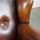 Sheepskin leather wingback chair with a red corduroy seat cushion