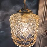 Moulded glass lamp with a cubic-spherical relief design.