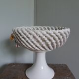 Cup on woven ceramic base with slip flowers
