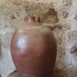 Vernified sandstone oil jar with handle