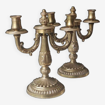 Duo of Candlesticks with 2 arms of light. Louis XVI style. In gilded patinated bronze