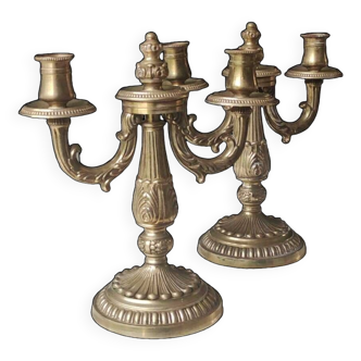 Duo of Candlesticks with 2 arms of light. Louis XVI style. In gilded patinated bronze