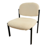 White and metal loop design armchair