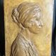 Patinated plaster bas-relief signed Robert Coutin, early 20th century.