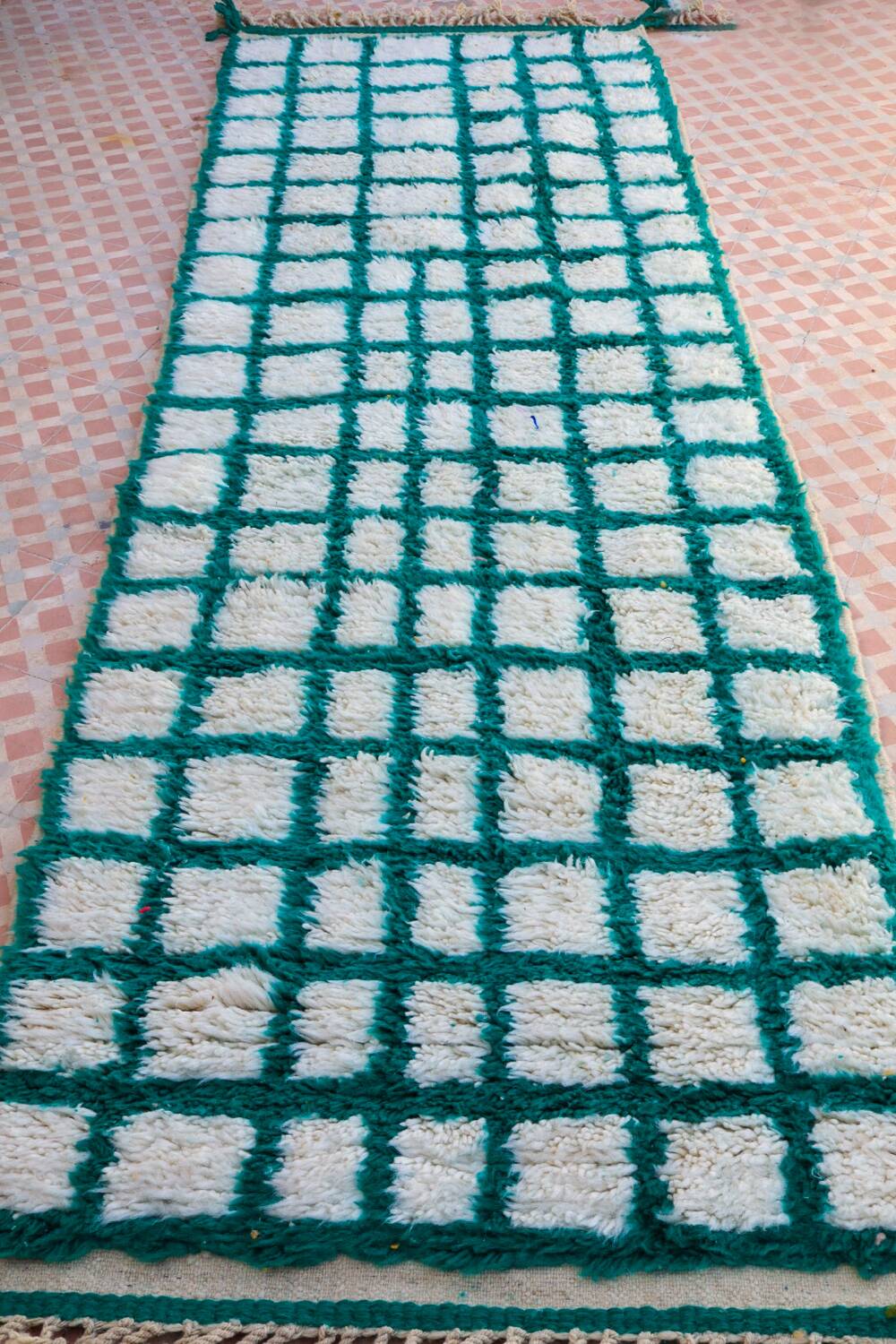 Moroccan hallway rug with inverted pine green and white checkerboard