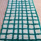 Moroccan hallway rug with inverted pine green and white checkerboard