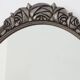 French Art Deco Oval Mirror with Carved Roses and Silver-Painted Frame