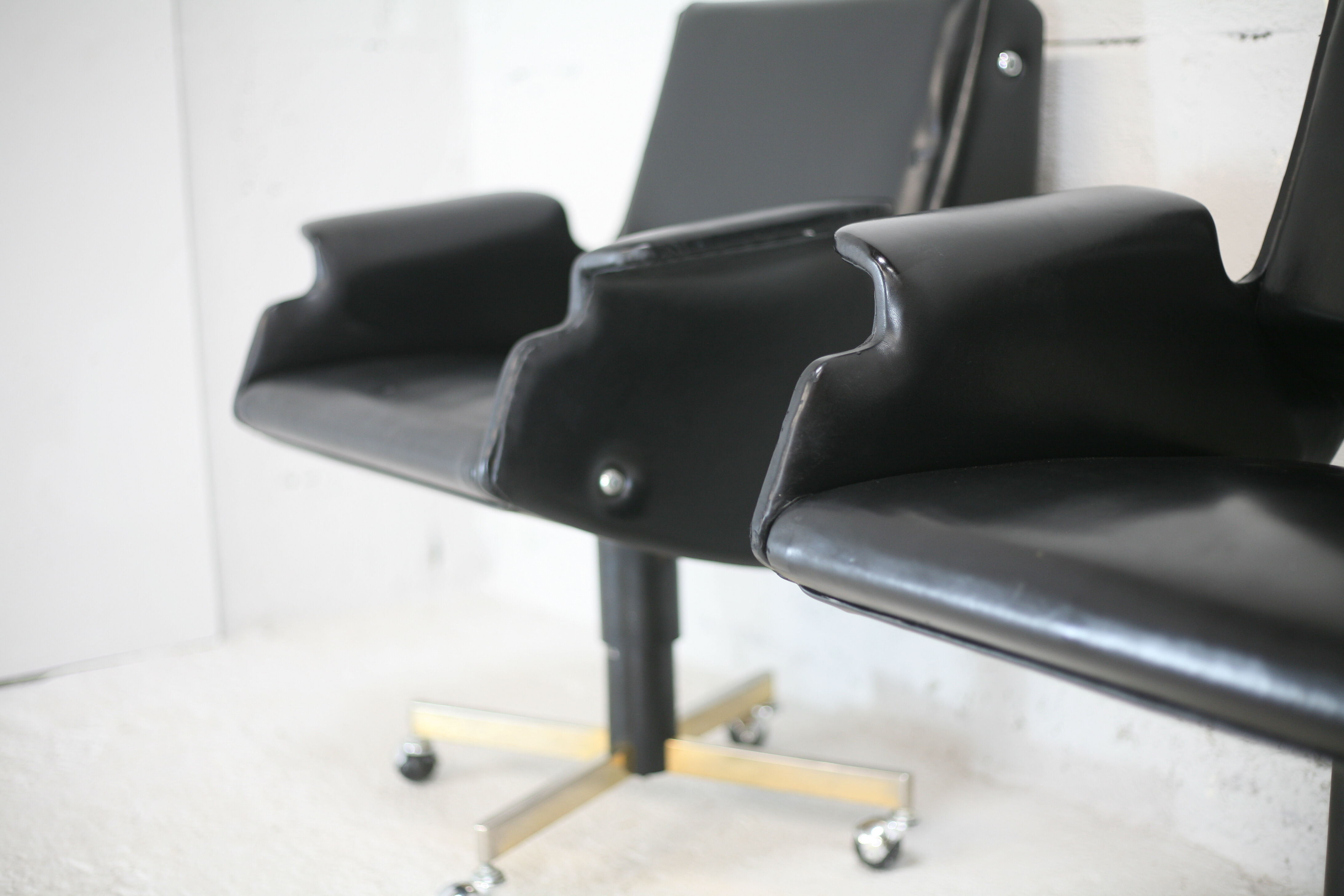 Pair of swivel armchairs, imitation leather and steel, Italy, circa 1960.