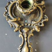 Antique Baroque/Rocaille style hand candle holder. In bronze with an old gold patina.