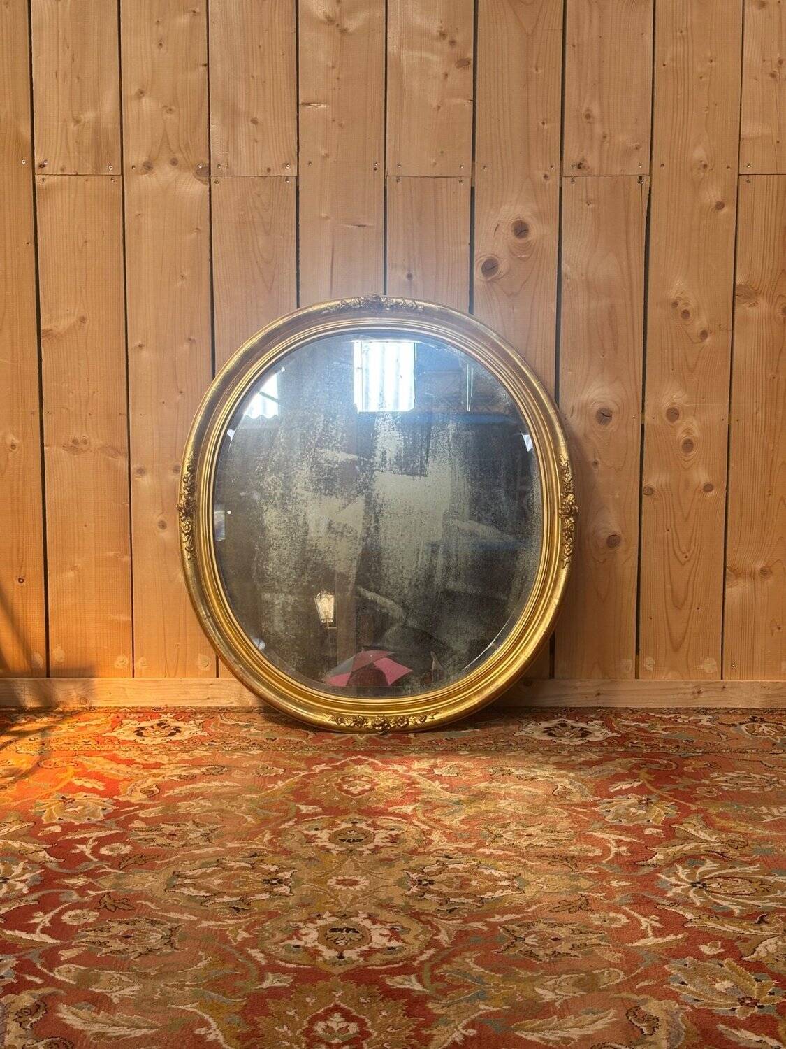 Miroir ovale biseauté bois doré style Louis XVI XIXe siècle