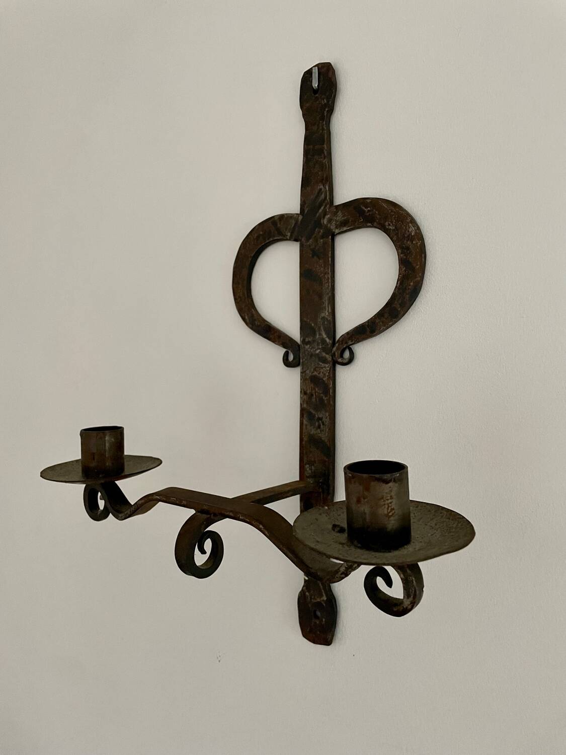 Brutalist wrought iron wall candle holder
