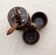 mustard with salt and pepper, brown enamelled sandstone with floral motifs