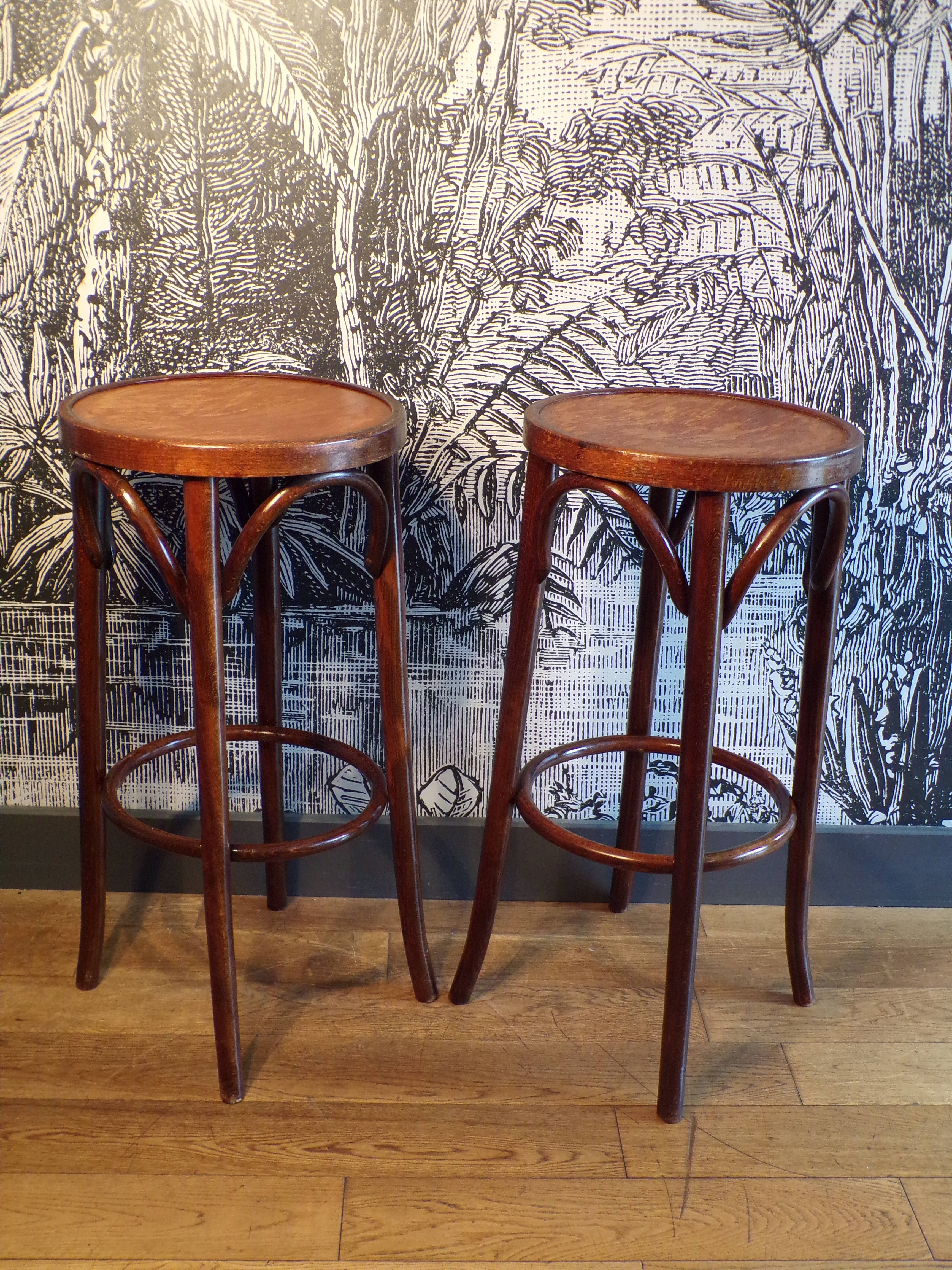 2 curved wooden bar stools
