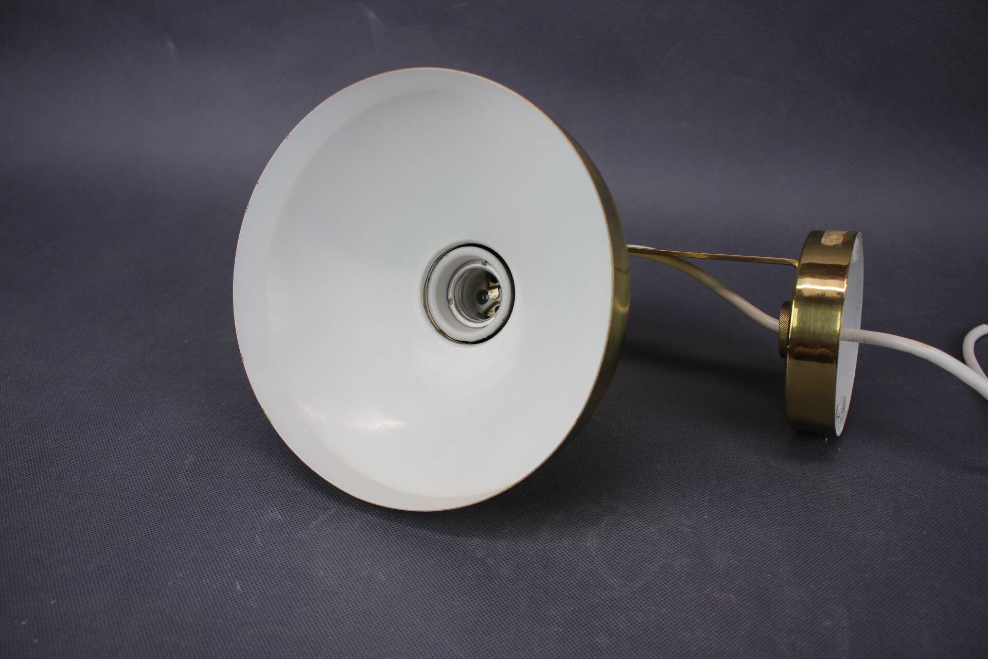 Set of four adjustable brass wall lights, Germany, 1960s.