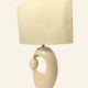 Cream ceramic table lamp with a mid-century design, featuring a lampshade.
