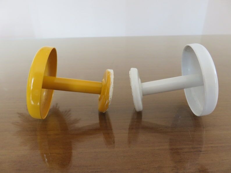 2 wall mounted coat racks in yellow and white metal 70s 80s