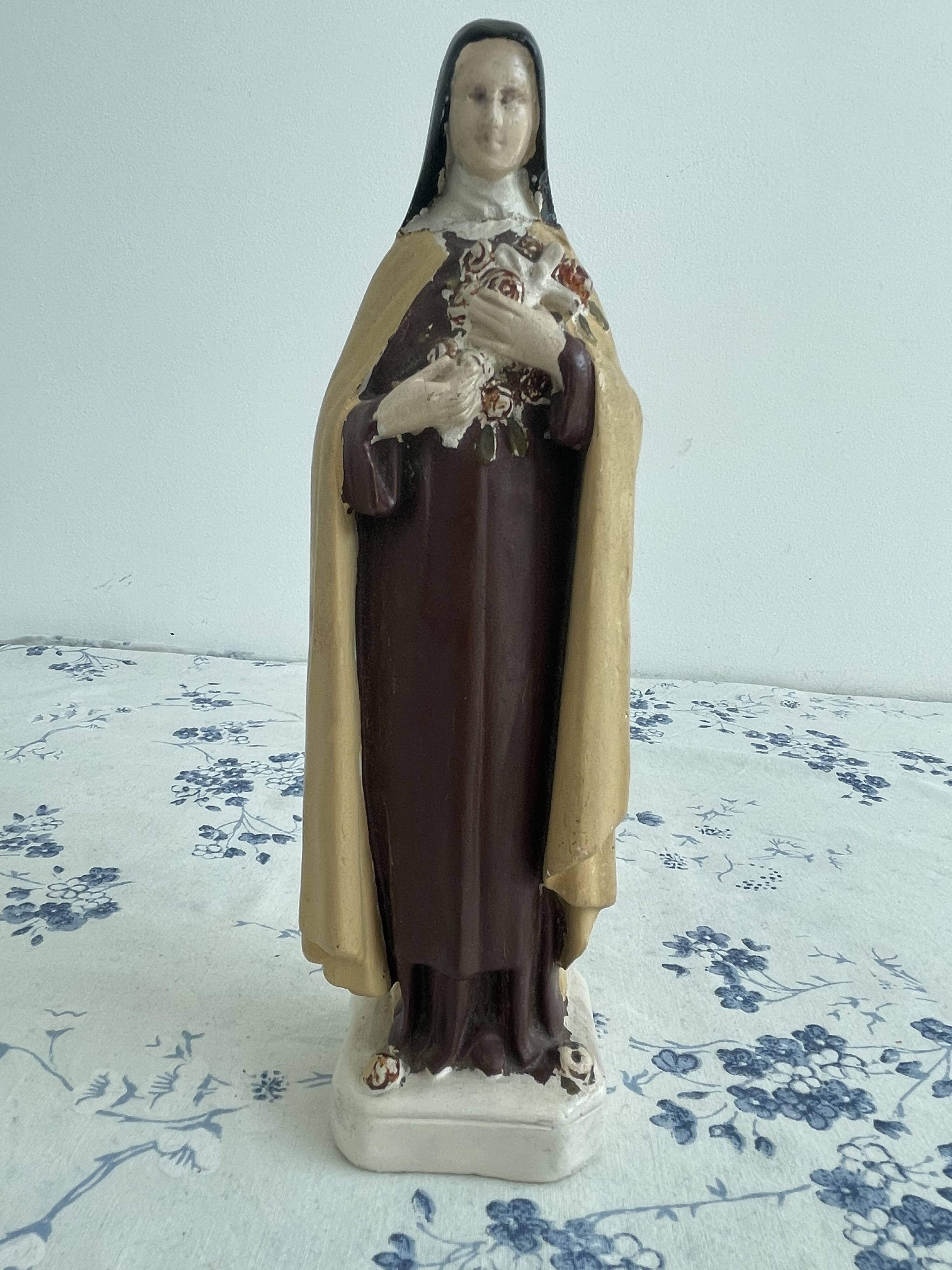 Antique statue of Saint Therese of Lisieux, religious plaster figurine
