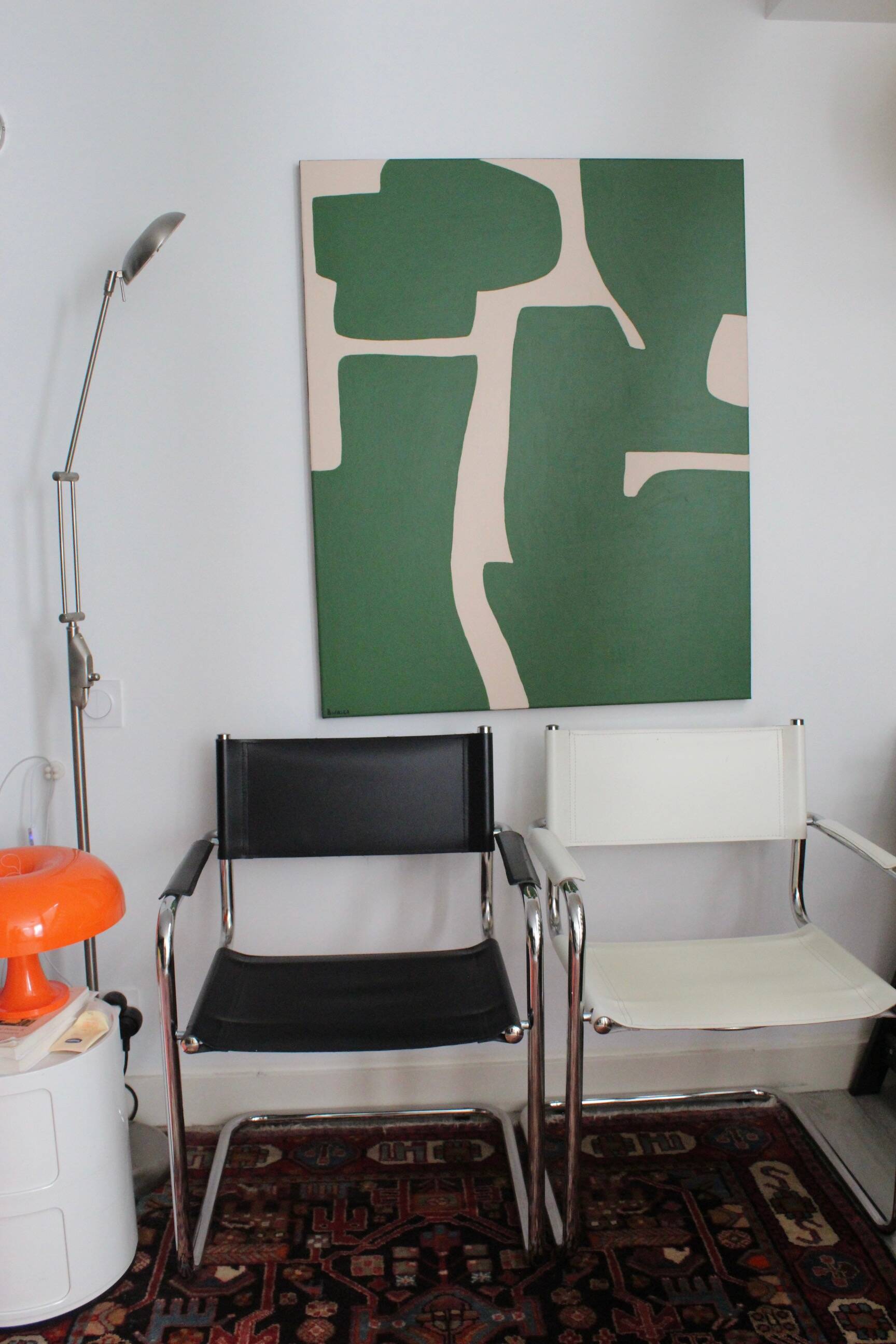 Abstract green art on a beige background.