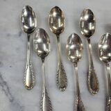 Set of 12 spoons of the middle twentieth in silver metal