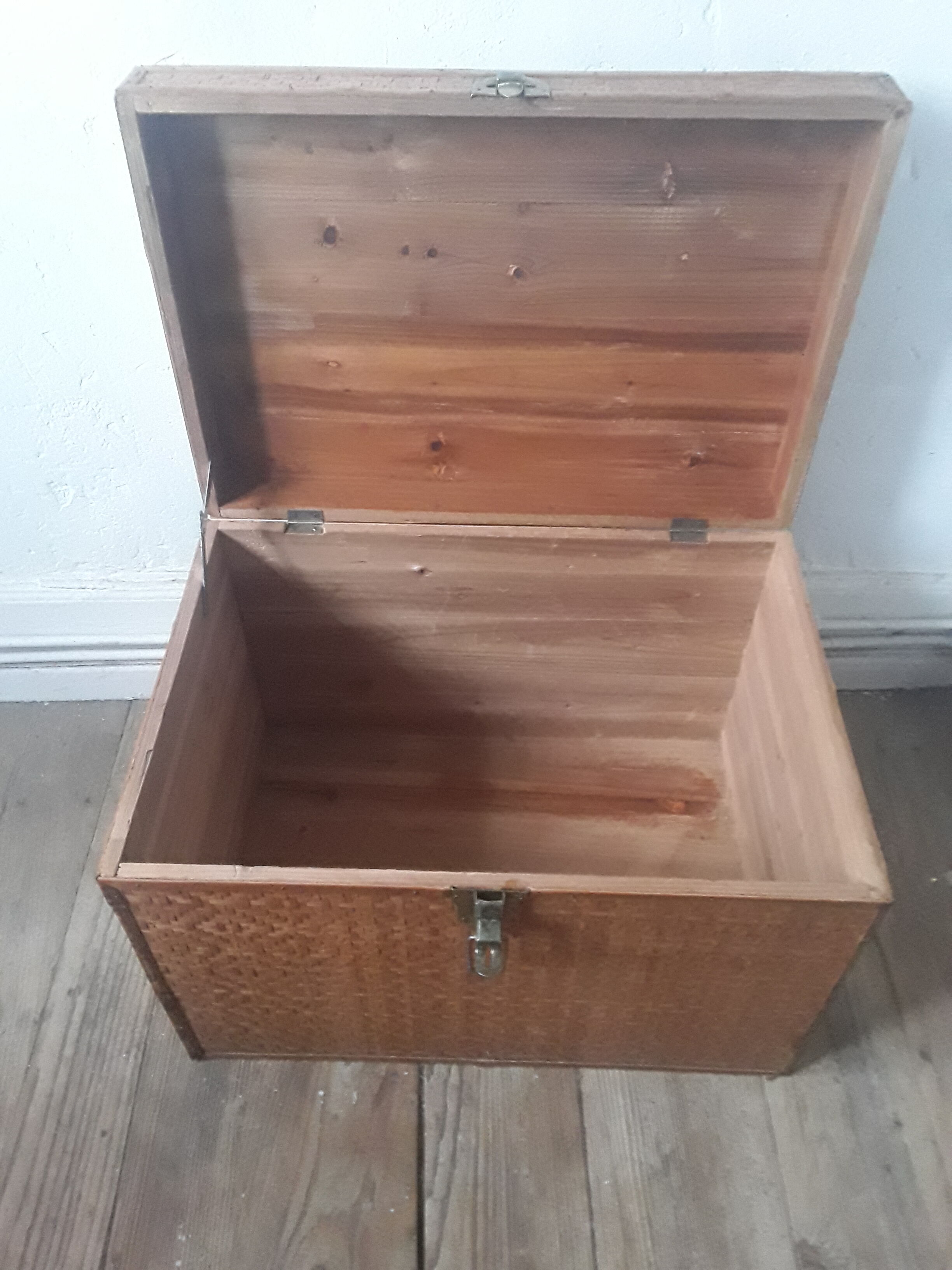 Wooden trunk with braiding