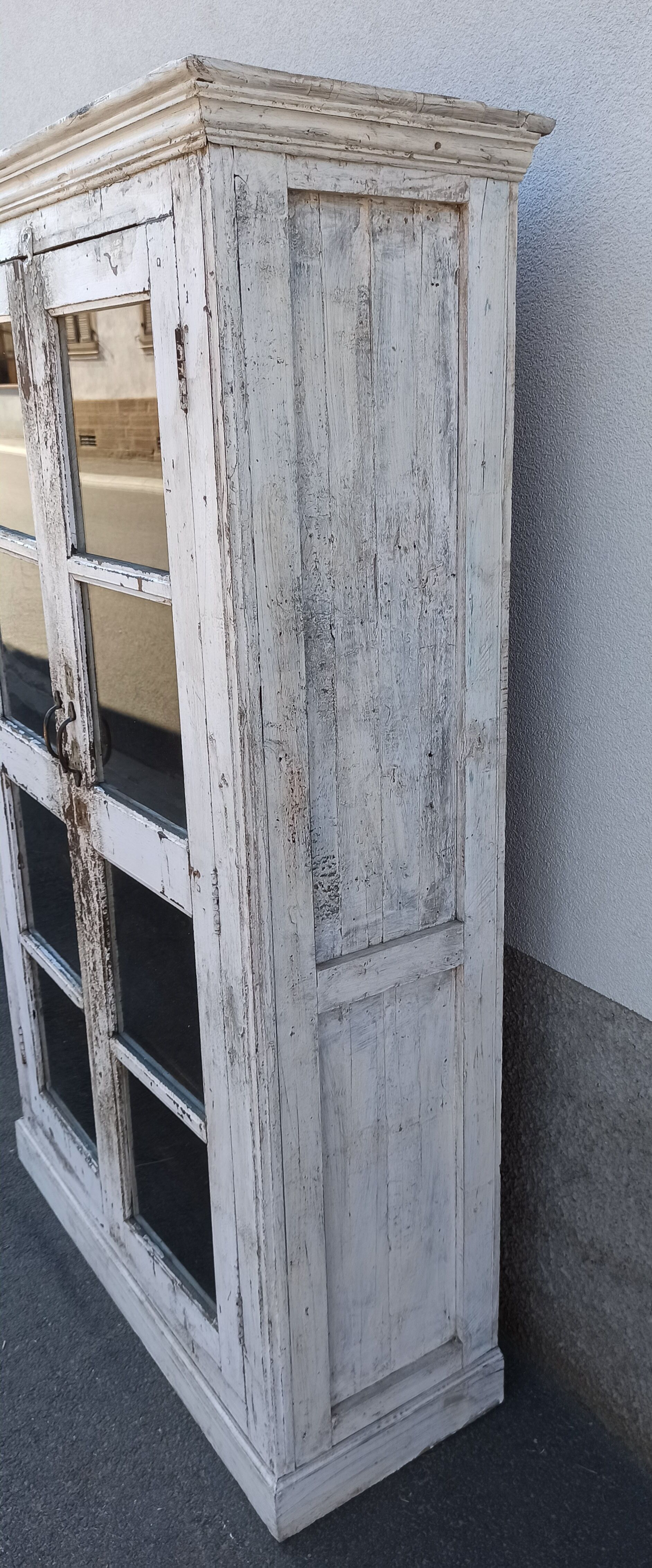 White wooden antique glazed wardrobe