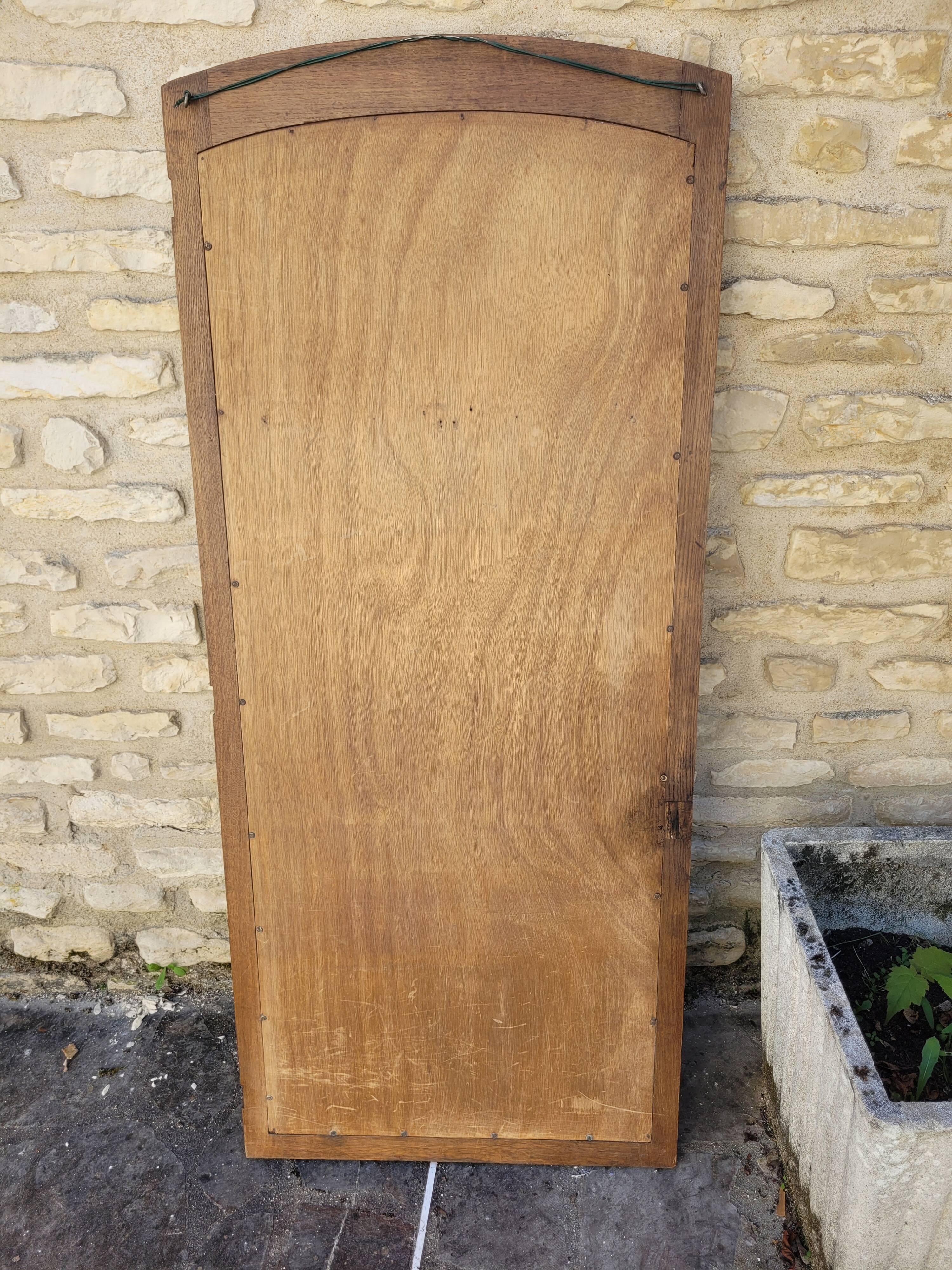 Art Deco oak mirror with bevelled glass from the 1930s.
