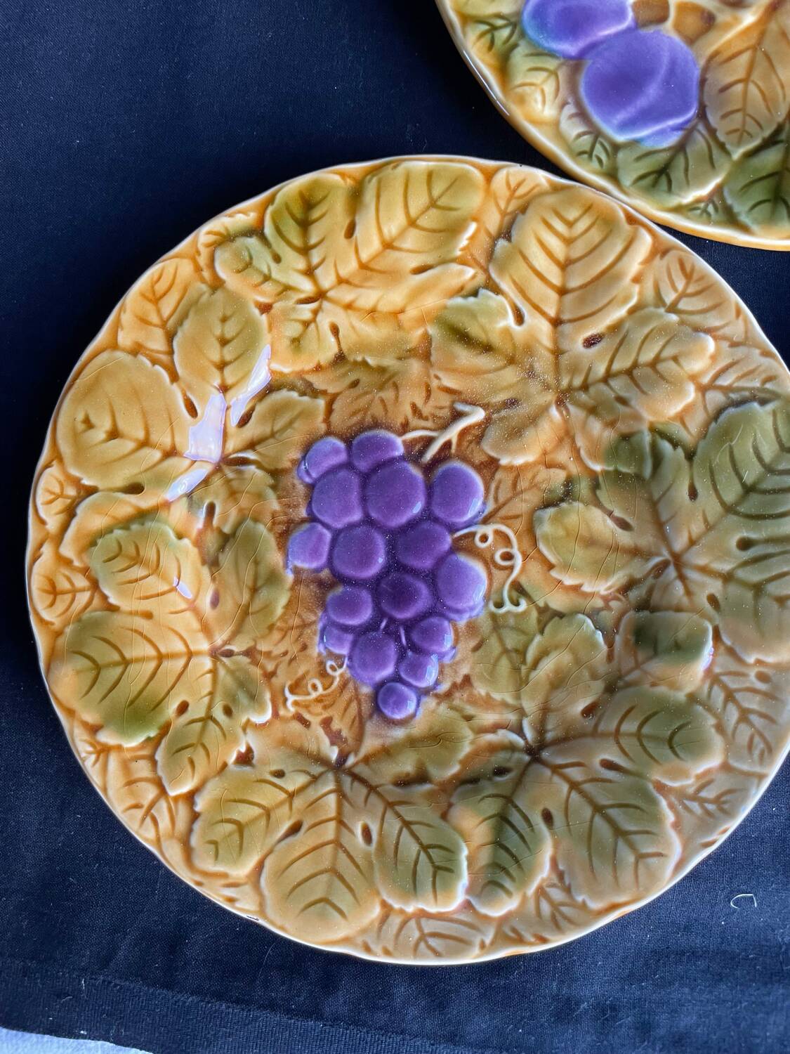 Set of four old Sarreguemines barbotine plates