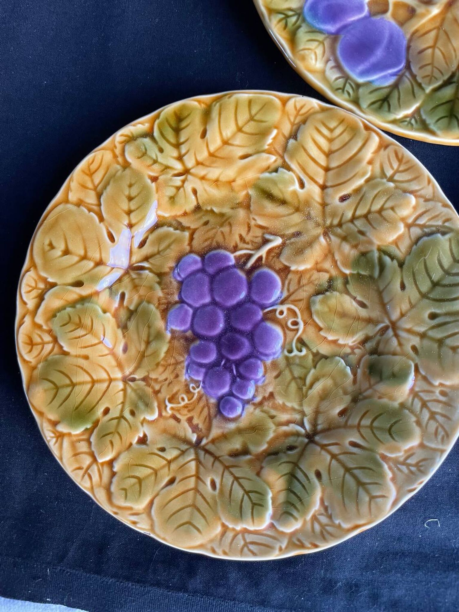 Together, four antique Sarreguemines barbotine plates.