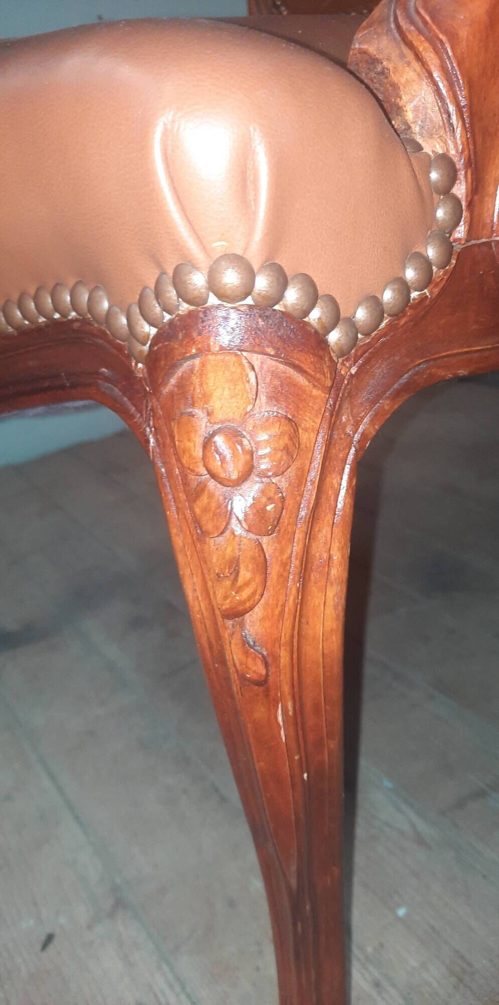Louis XV style armchair covered in leather.