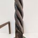 Pair of sculptural cast iron chenets with twisted heads