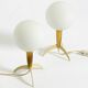 Two Mid-Century Modern rocket table lamps in brass and glass