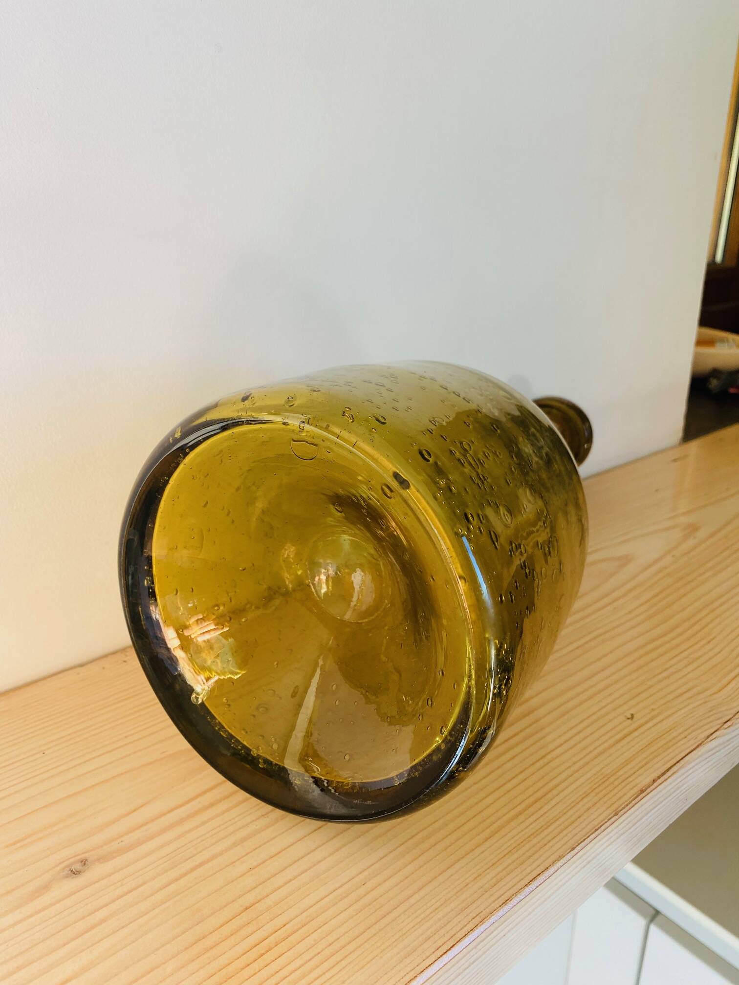 Amber colored Biot bubble glass bottle