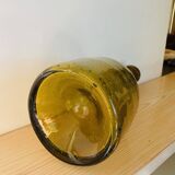 Amber colored Biot bubble glass bottle