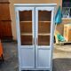 Armoire bibliothèque cérusée et grillagée
