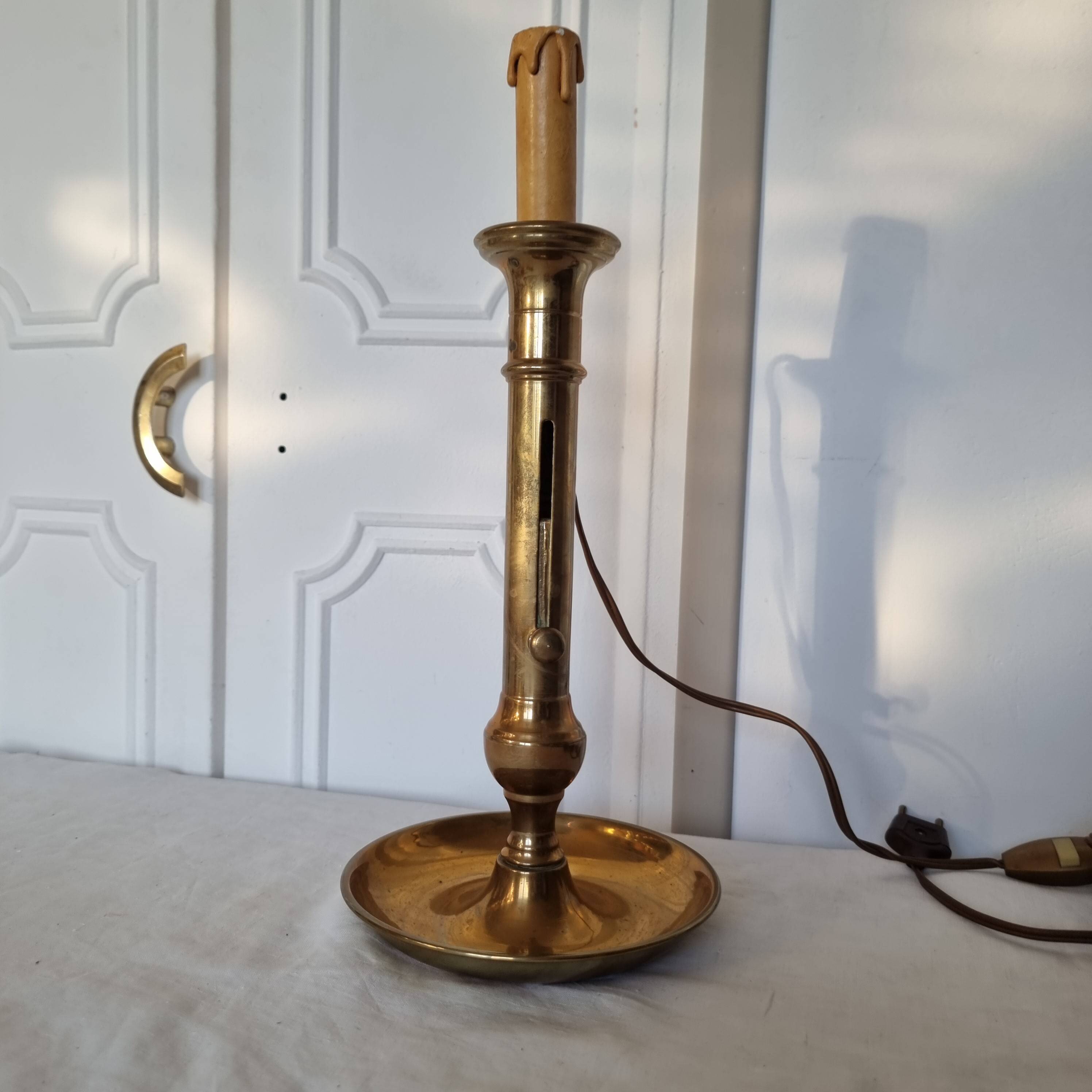 Brass table lamp made from an antique 19th century candlestick or candle holder.