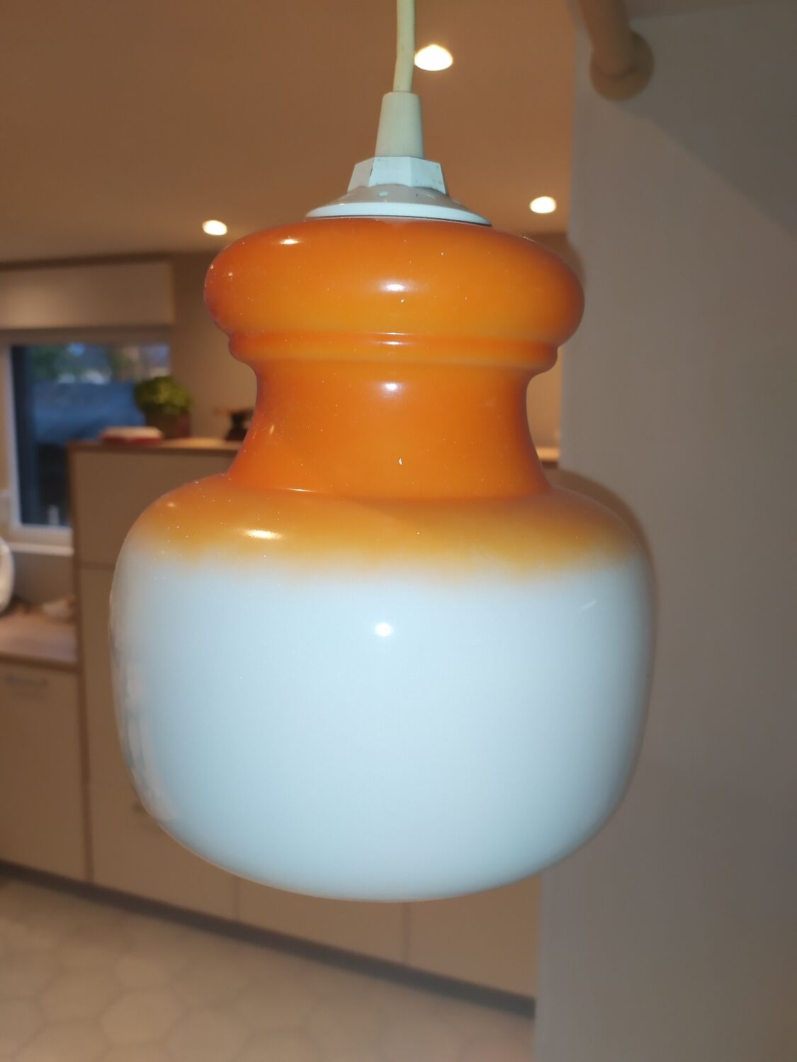 Pendant light in orange and white opaline