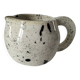 Small speckled ceramic jug in a vintage workshop style.