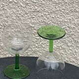 5 transparent glass glasses and green glass vase go