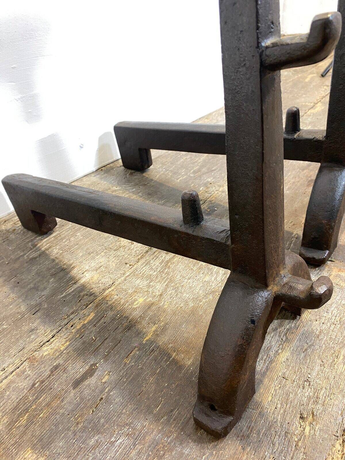 Pair of antique cast iron fire dogs, rustic decor, around 1900.
