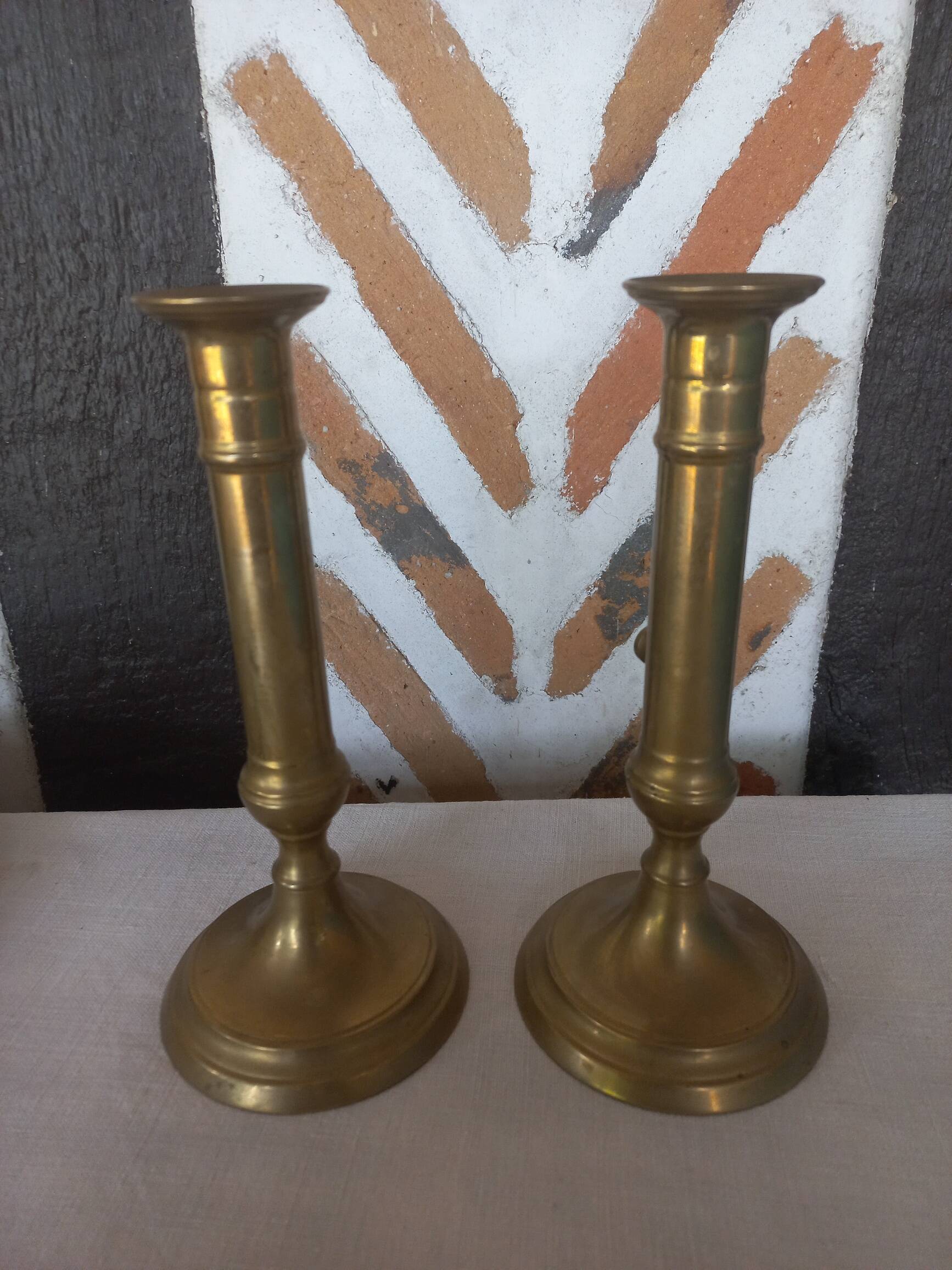 Pair of brass push-button candlesticks