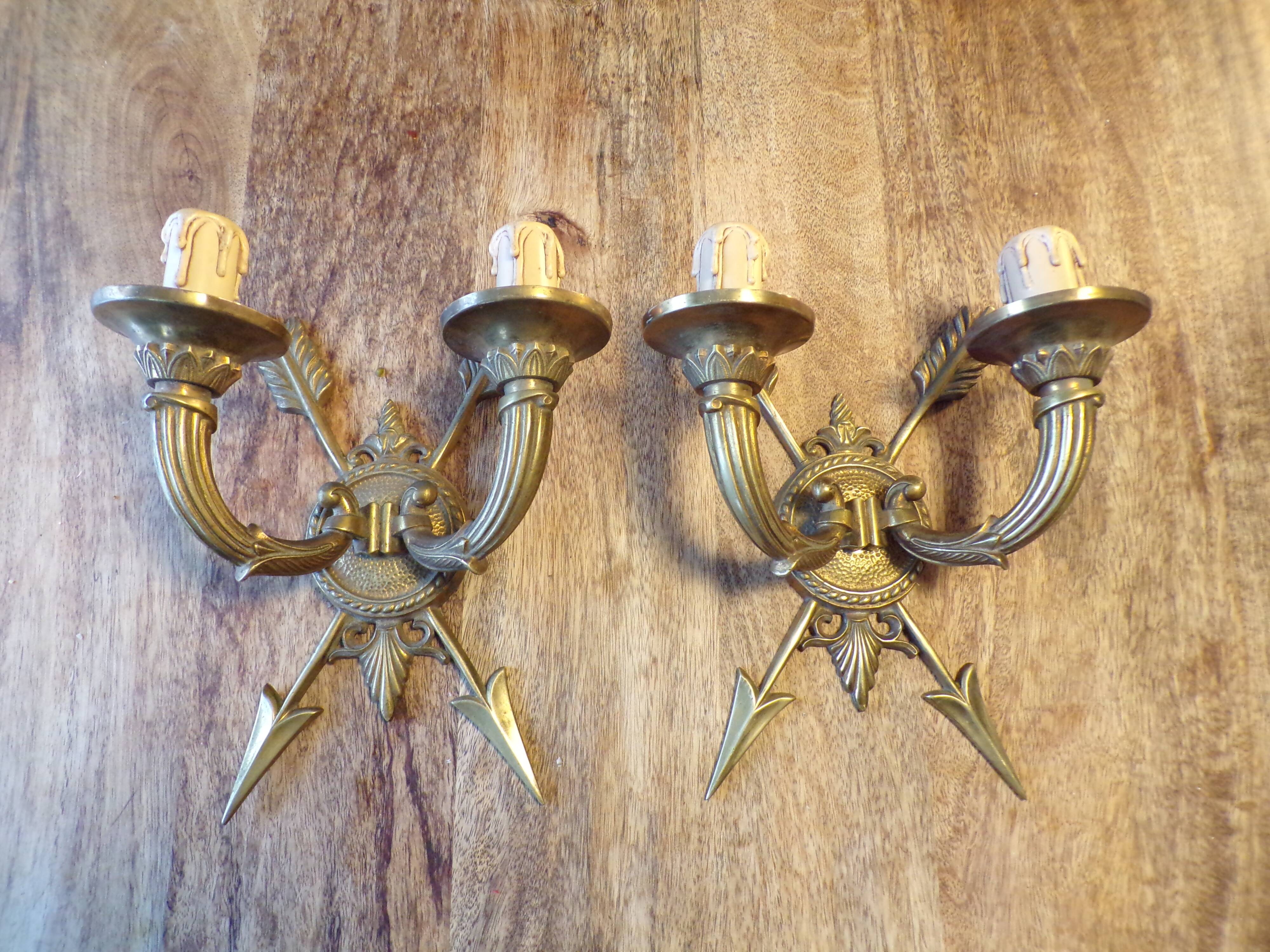 Pair of empire style bronze arrow wall lights