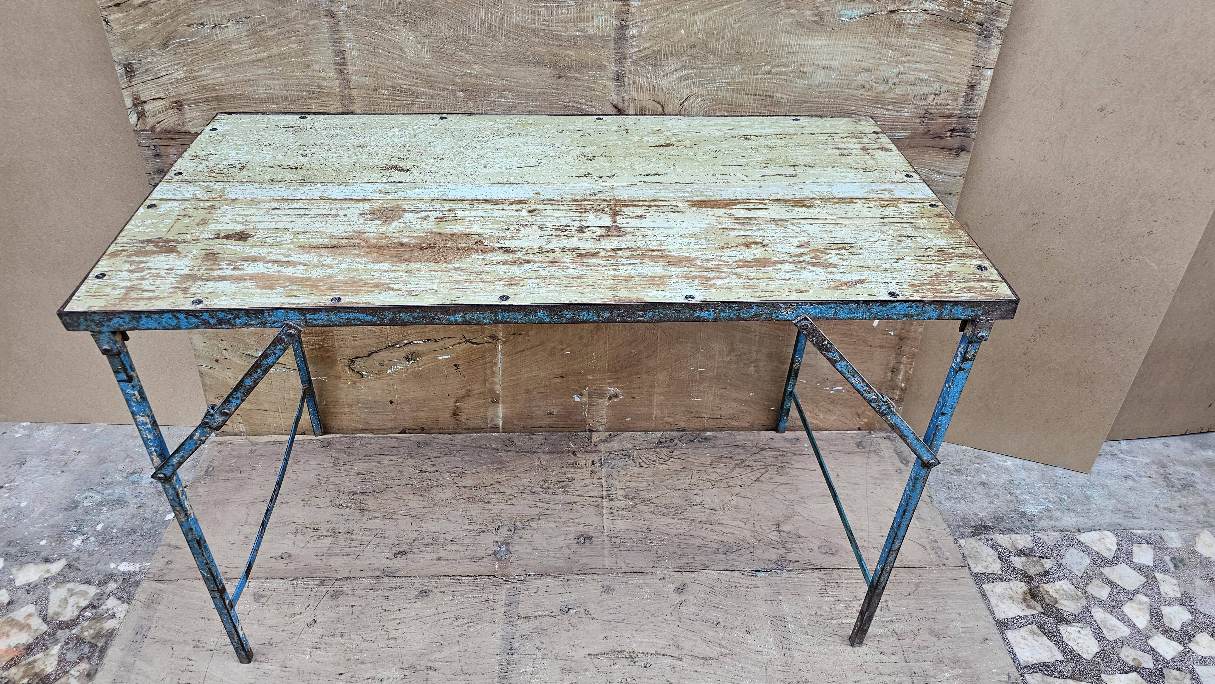 Old folding table in Burmese teak and steel