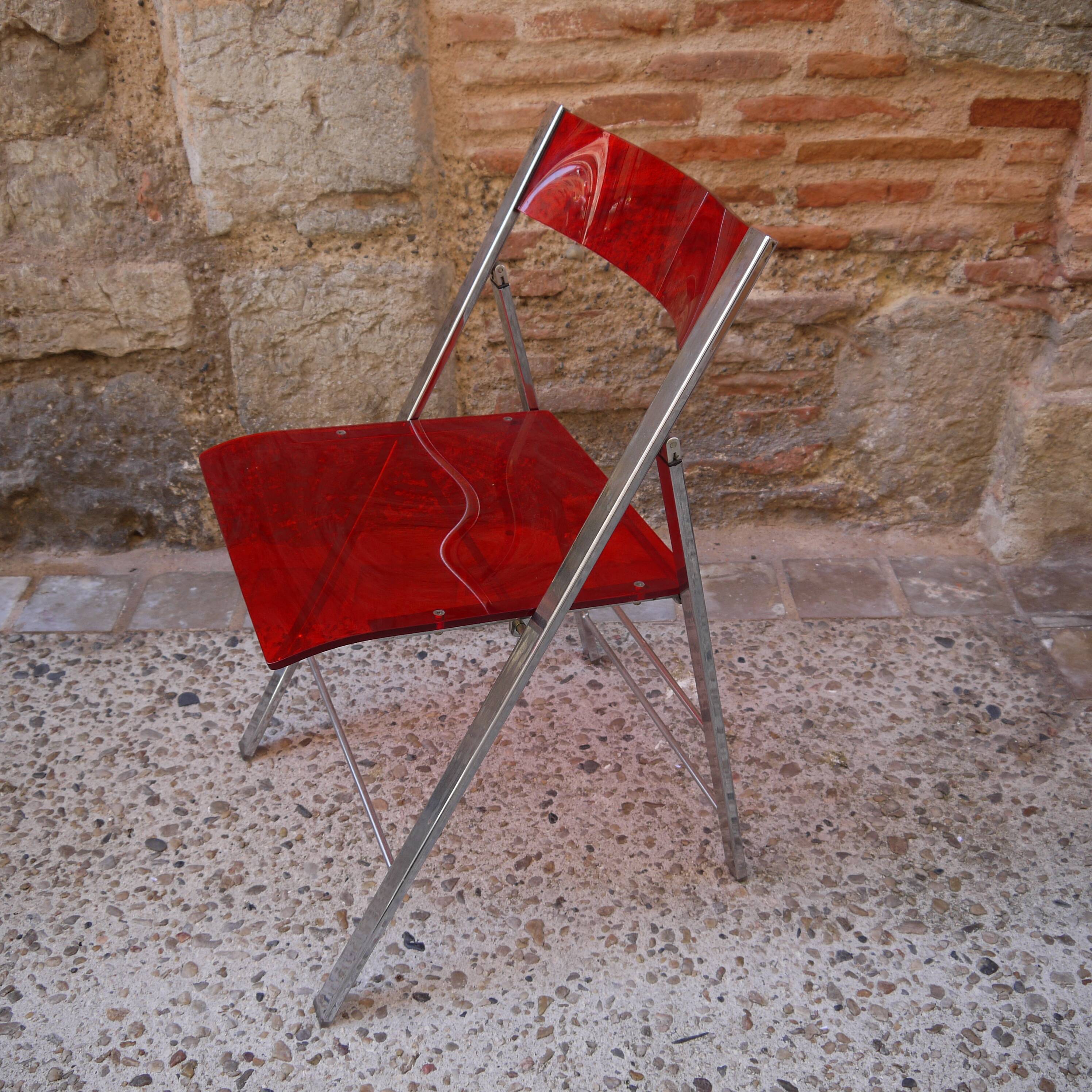 Red Plexiglas folding chair