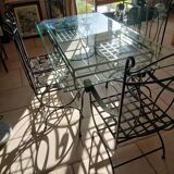 Glass table and wrought iron chairs