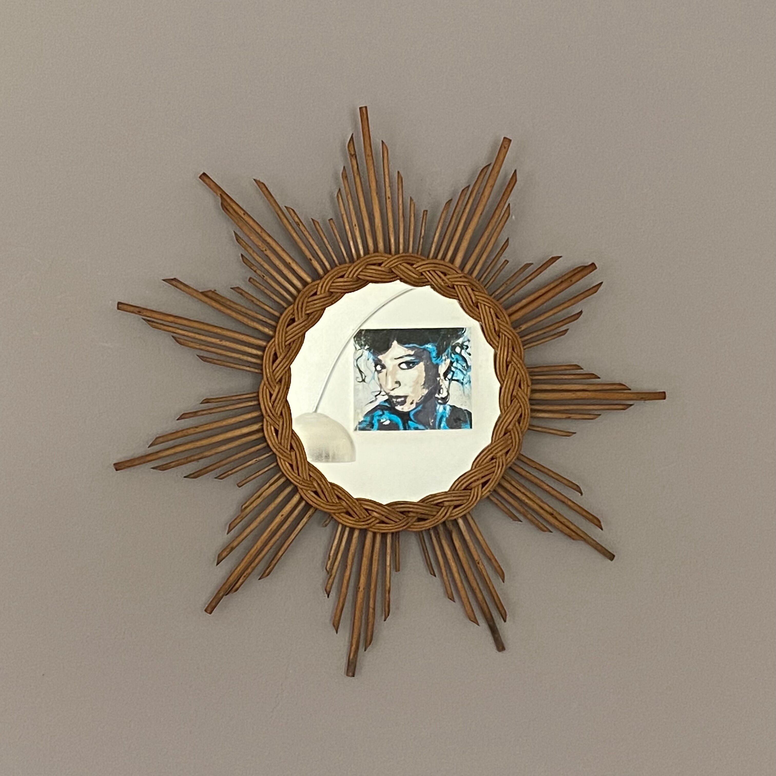 Sun mirror in braided rattan. 1960. 50cm.