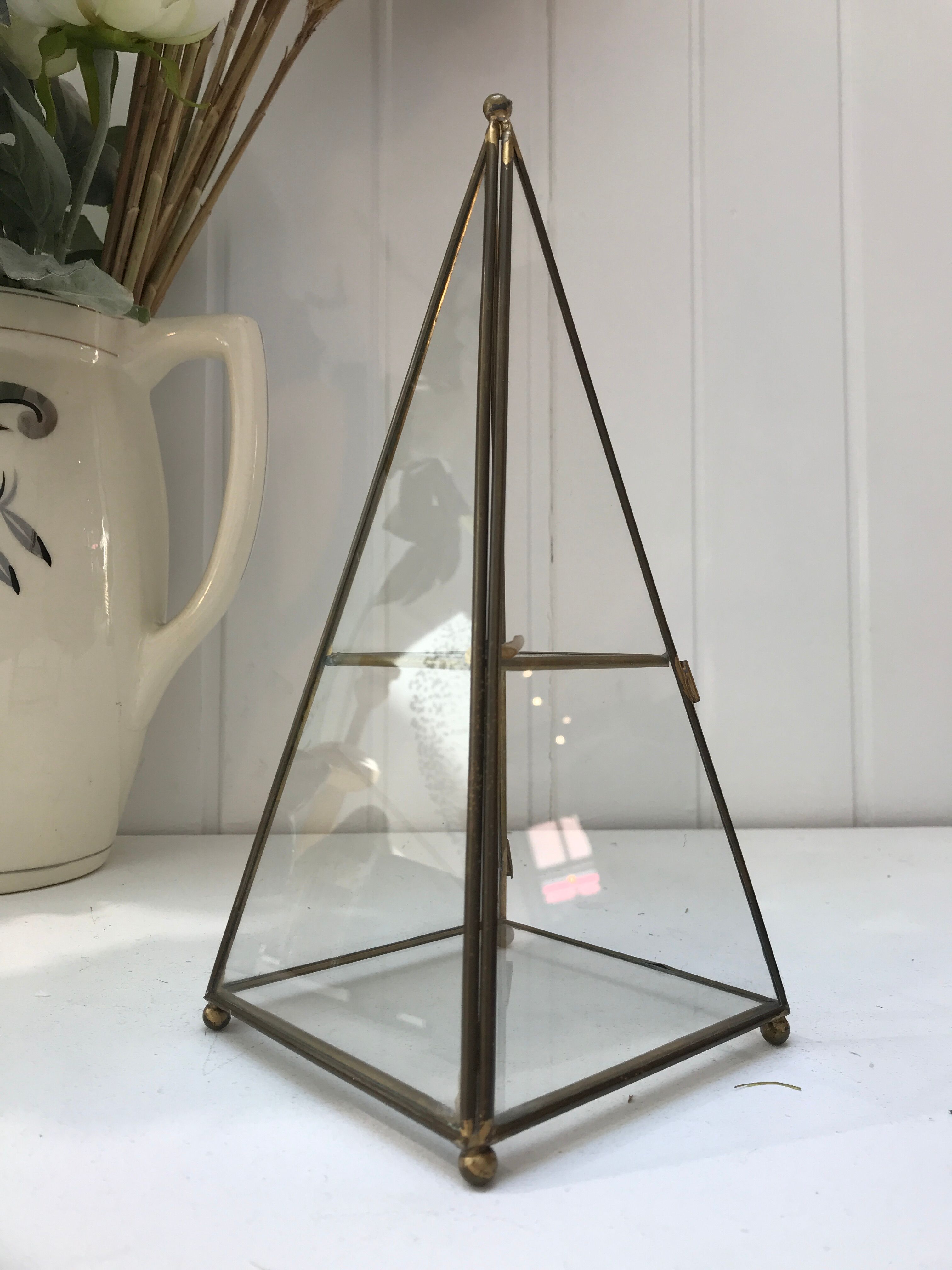 Brass pyramid showcase
