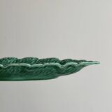 Green earthenware dish in the shape of a leaf