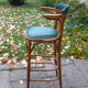 Bar stool in green leather and curved wood