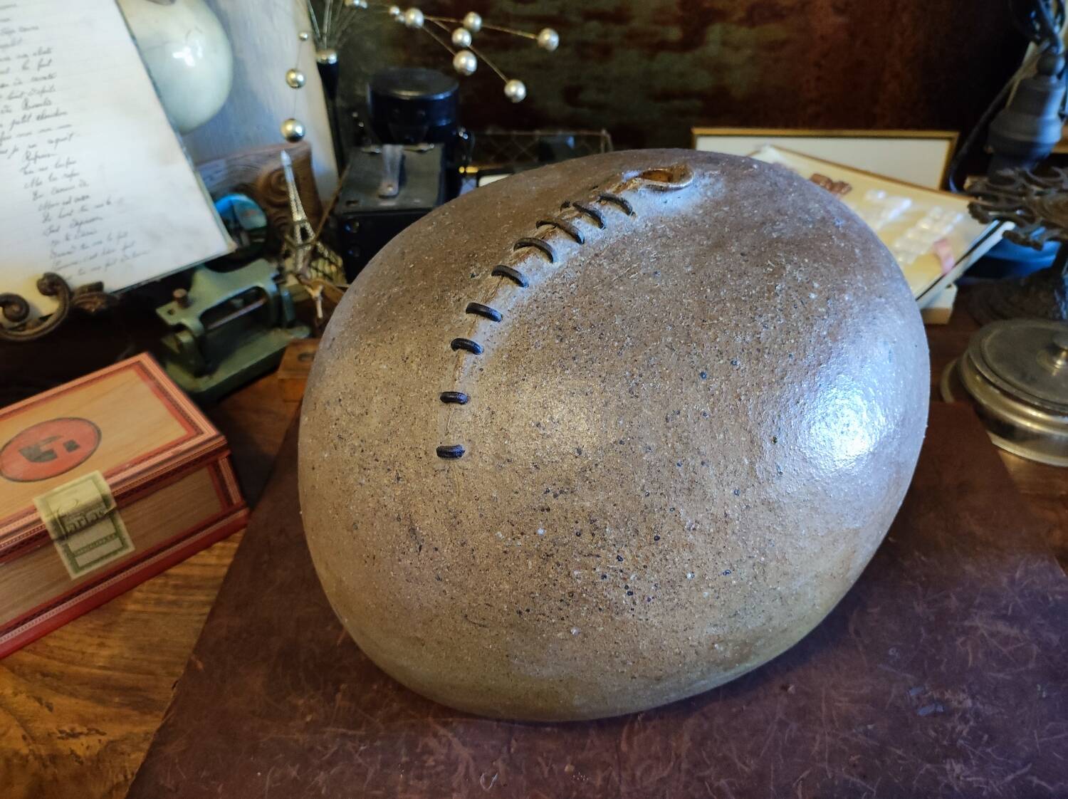 Vintage sandstone vase, in the shape of a rugby ball, signed